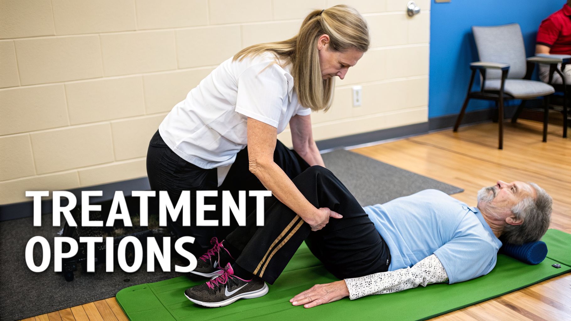 A physical therapist guides an older male patient through a leg exercise on a green mat.